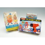 Three vintage children's toys; Mr Egg-Bodd and his friend Mr Potato-Head, Porky's Speed Boat and