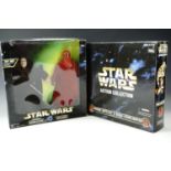 A boxed Star Wars Action Collection electronic Emperor Palpatine and a Royal Guard together with a