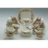 An Edwardian 12 place tea set by Wellington China, Longton