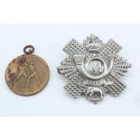 An RAF boxing prize medallion together with an HLI cap badge