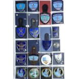 A large collection of NATO military fob and other badges