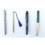 A British "Nova" lever action fountain pen, with blue marbled barrel, and two other fountain pens,