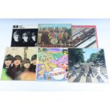 Seven The Beatles LP records including "Beatles For Sale", "Abbey Road" etc together with two E.