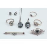 A selection of silver and hematite jewellery, comprising a necklace and a pendant of faceted