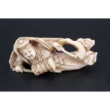 A Japanese ivory netsuke of a Tennin playing a drum, 5.5 cm