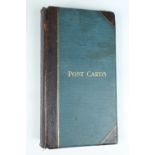 A vacant Edwardian postcard album, having cloth covered boards with calfskin spine and corners, 40