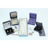A selection of white metal and costume jewellery