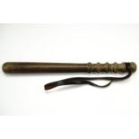 A Police truncheon with hide grip, 38 cm