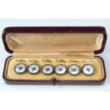 A cased set of mother-of-pearl dress buttons, 14 mm diameter