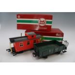 Three boxed L.G.B. garden model railway carriages including "Red Caboose", together with a "Work