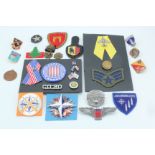 A USAF Pararescue badge together with sundry other items of military and related insignia