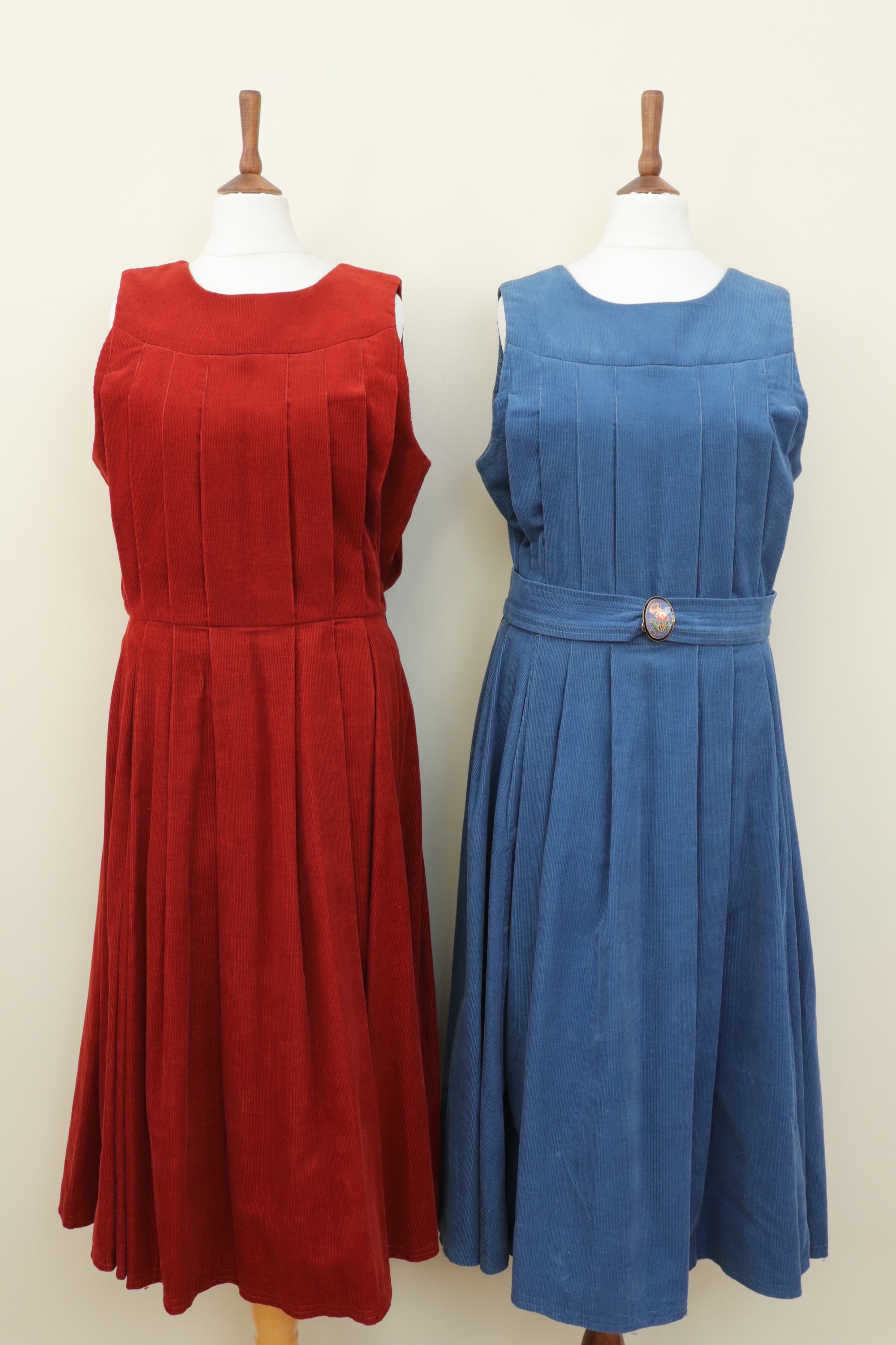 Two vintage Droopy & Browns corduroy dresses, one having a floral enameled belt clip, label size 14