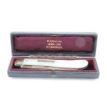 A Victorian mother of pearl handled silver fruit knife, in a leather retailer's case for Rankin,