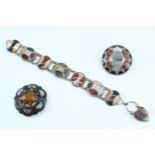 A Victorian Scottish polished hard stone bracelet and two boss brooches