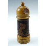 A Belle Epoque treen Lilly of the Valley perfume bottle case, bearing an embossed and printed label,