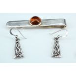 A pair of contemporary Celtic inspired white metal ear pendants, together with a silver money clip