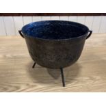 A three legged cast iron pot 27 cm x 23 cm