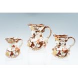 A late 20th Century graduated set of three Mason's Brown Velvet jugs, having octagonal bodies,