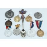 A group of Victorian and later royal commemorative badges and medallions, together with a related