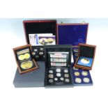 A collection of cased QEII royal commemorative coins together with further commemoratives etc