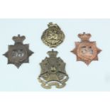 Four various 34th and 55th Regiments of Foot glengarry badges, (a/f)