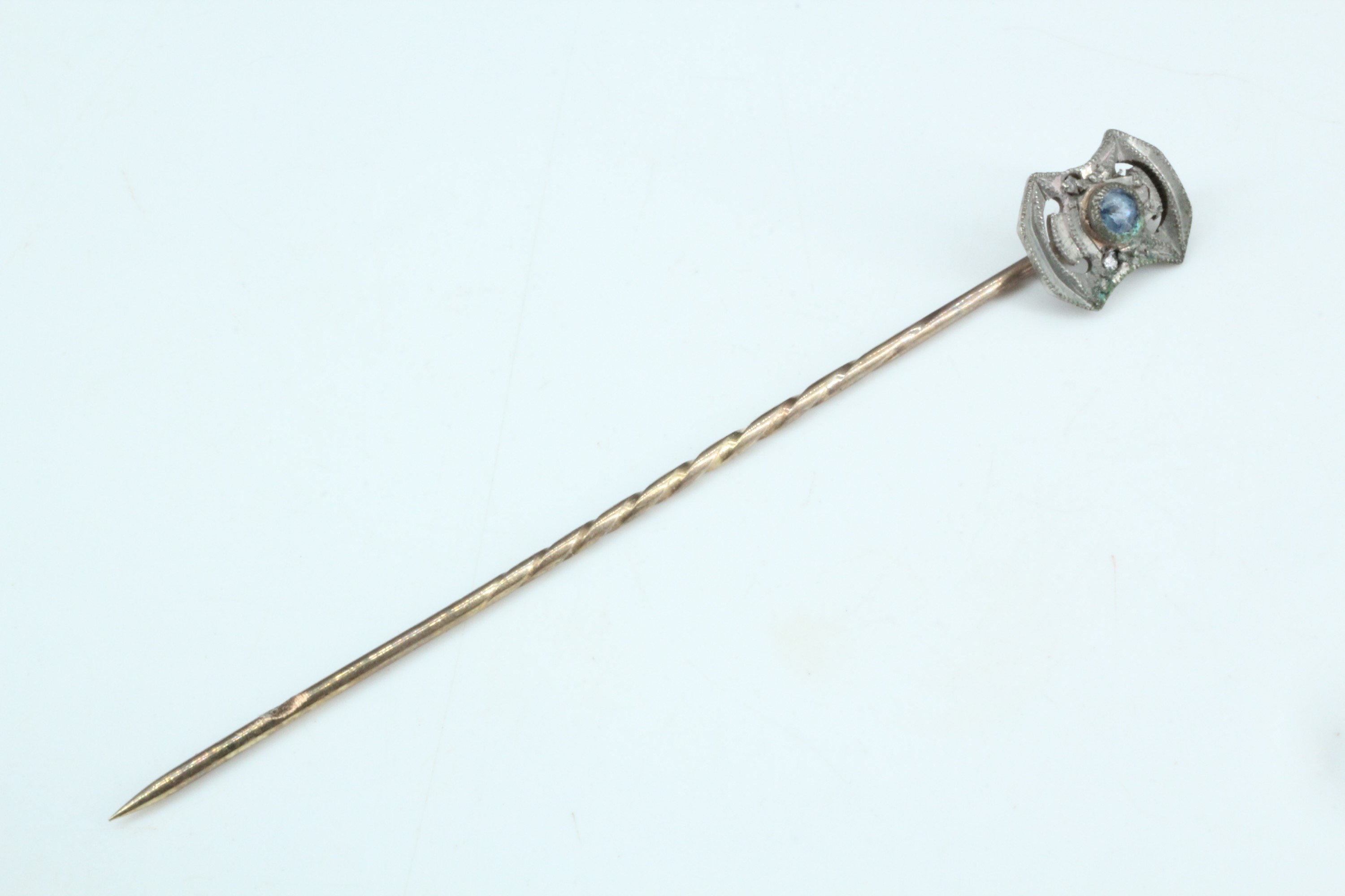 A Victorian sapphire and yellow metal stick pin