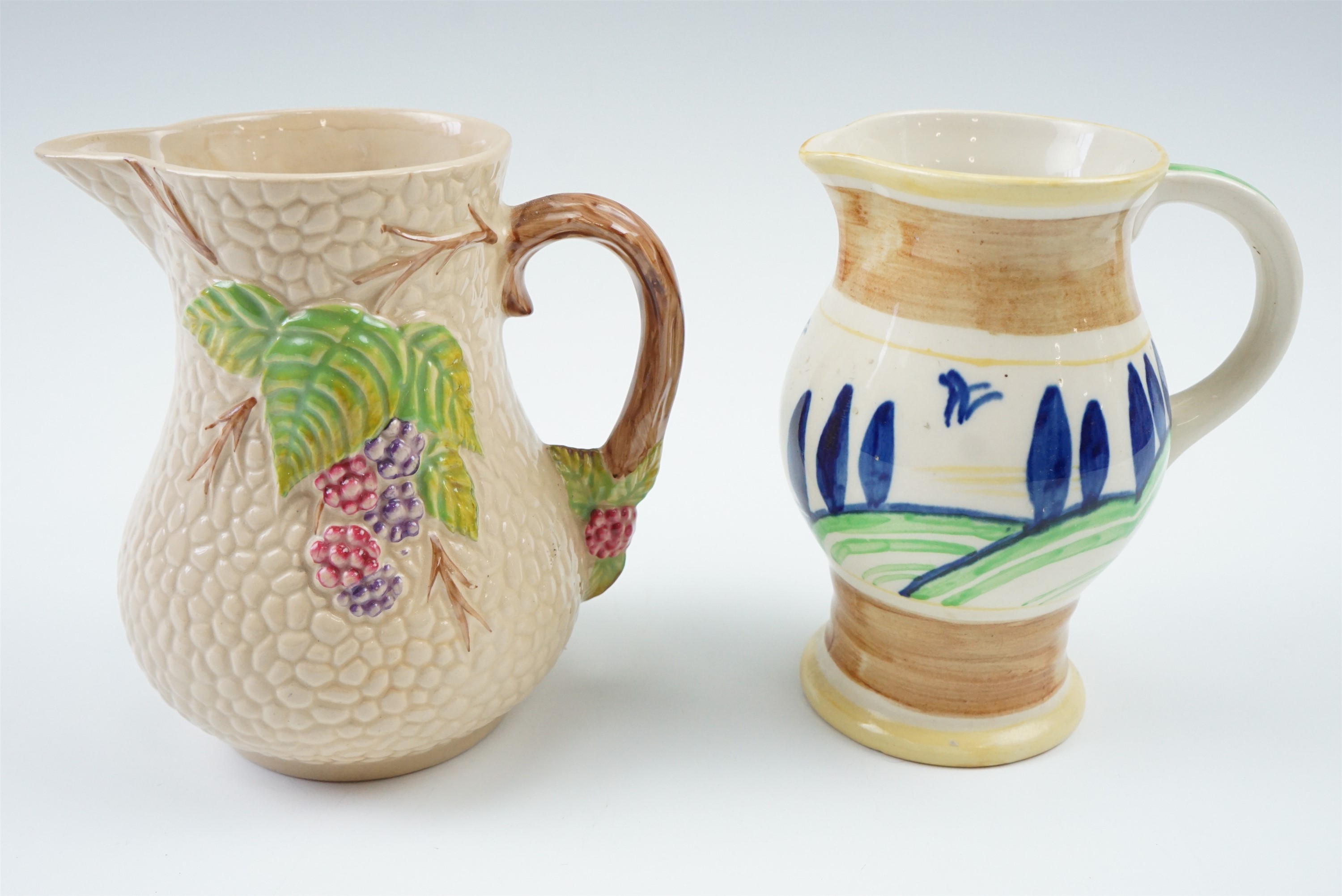 A Wade bramble pattern jug together with a Royal Doulton hand painted jug, 12.5 cm, circa 1930s -