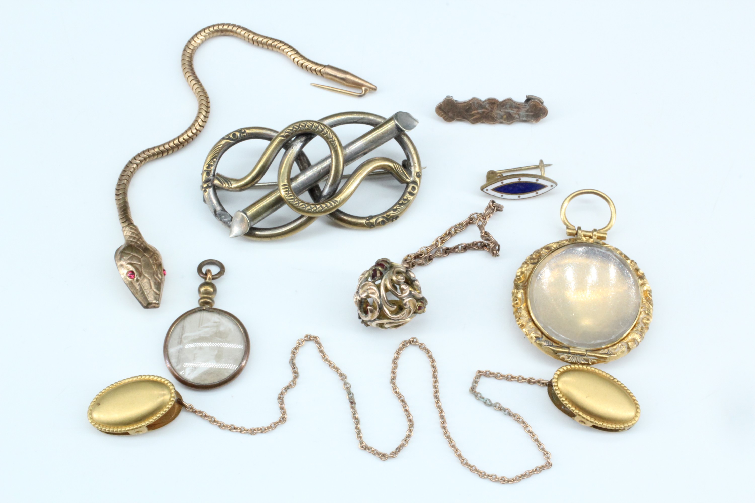 A group of Victorian and early 20th Century gilt metal jewellery including a pendant bauble, a