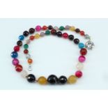 A necklace of graded and faceted semi-precious gem stone beads, largest 16 mm, 52 cm