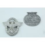 A German Third Reich police cap badge, together with a day badge
