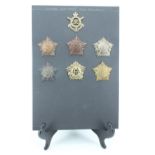A group of Guards Machine Gun Regiment / Corps cap badges