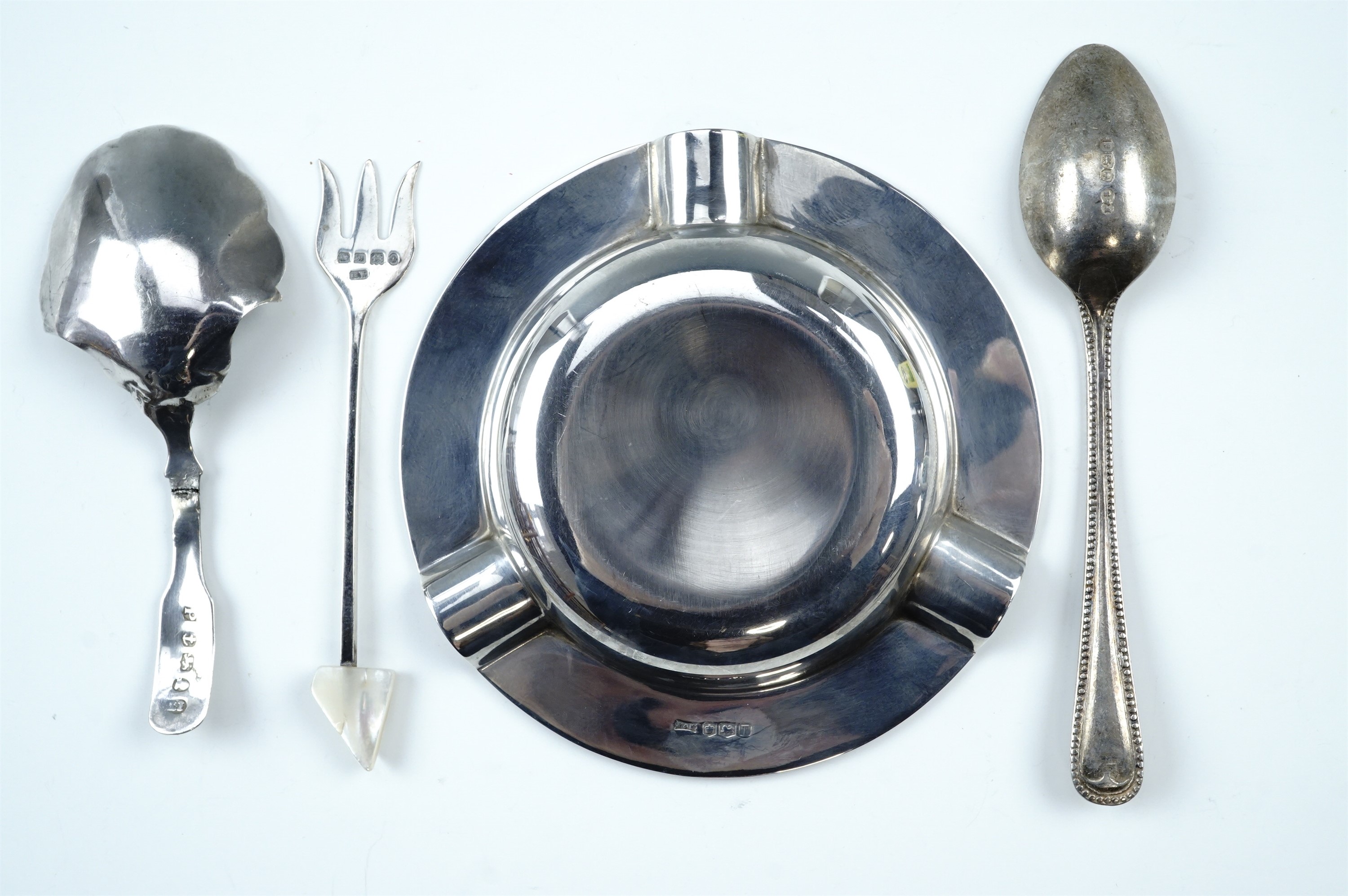 A Georgian silver caddy spoon together with a silver ashtray, a silver pickle fork and tea spoon - Image 3 of 4