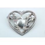 [George Jensen] Silver robin in a heart brooch by Coro, having a stylized robin in an openwork heart