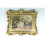 An ornately framed Victorian watercolour study of flowers, having flowers lying on a table beside