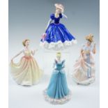 Four Royal Doulton figurines: Cinderella from the Disney Princesses series; and three figures of the
