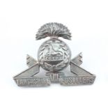 A Lancashire Fusiliers officer's white metal cap badge, (tested a silver)