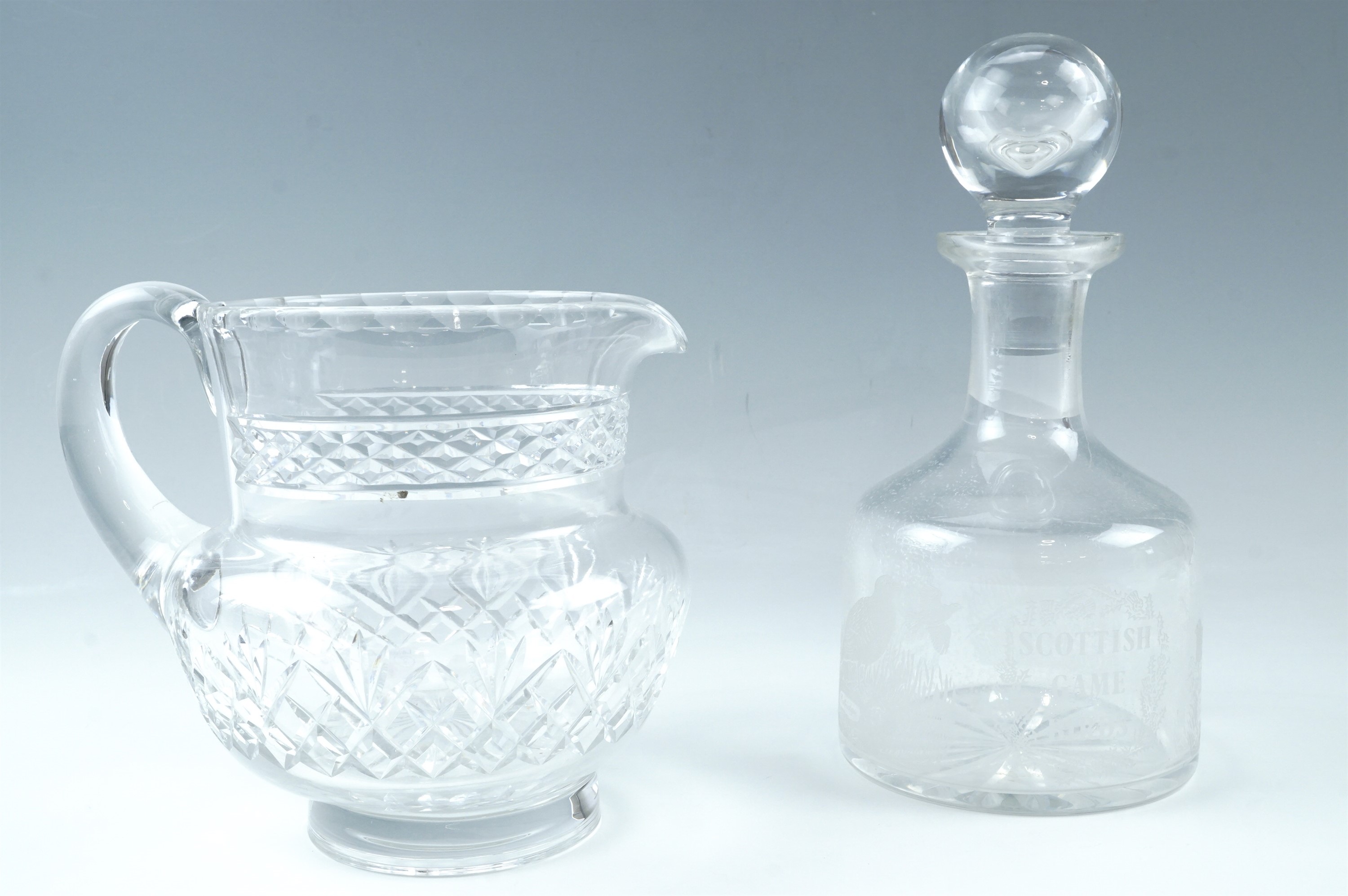 An Edinburgh Crystal "Scottish Game Birds" etched glass decanter, together with a cut glass whisky