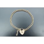 A fine curb link chain bracelet with a locket clasp, London, 1978, 9.37 g, 18 cm long