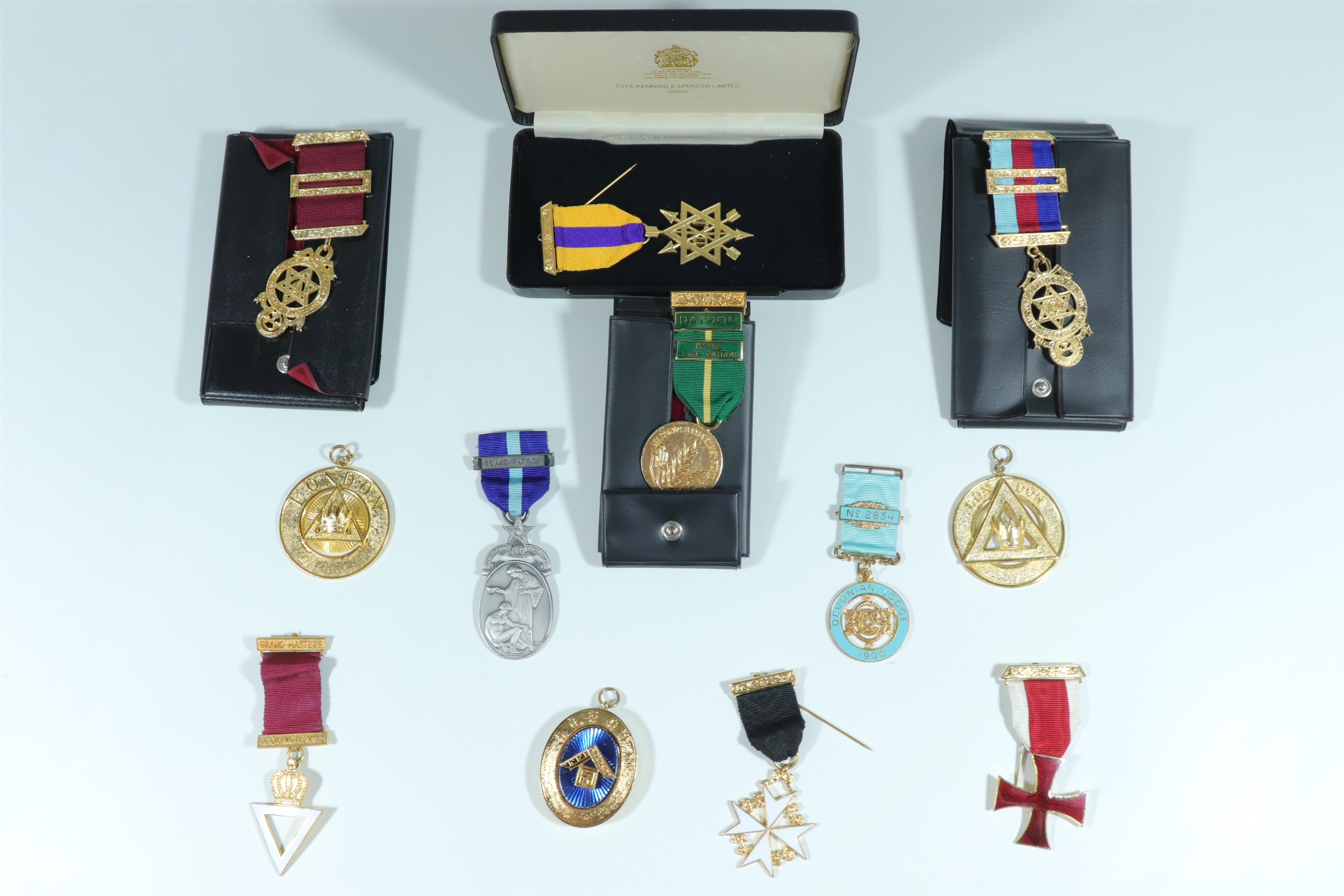 Three cased Masonic jewels from Toye, Kenning and Spencer of London, together with ten others