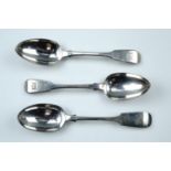 Three various 19th Century silver fiddle pattern desert spoons, London, 1823 and London, 1885, 145