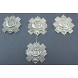 A group of Highland Light Infantry volunteer battalion cap badges