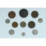 A small group of coins including a George IV silver crown