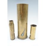 A 25 pounder brass shell case and two other cases