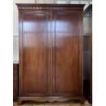 A reproduction Georgian mahogany wardrobe, 130 cm x 64 cm x 188 cm