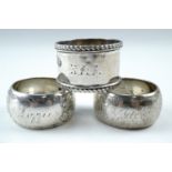 A pair of George V silver napkin rings, respectively engraved "Jack" and Lizzie", together with