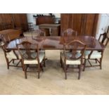 A Bevan-Funnell reproduction Regency mahogany extending dining table, having a string-inlaid and