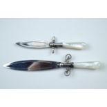 Two mother-of-pearl and white metal book marks in the form of daggers, (tested as silver)
