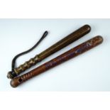 Two late 20th Century police truncheons, longest 42 cm