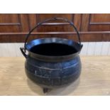 A large cast iron cauldron 43 cm x 31cm