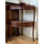 A reproduction George III mahogany corner wash stand